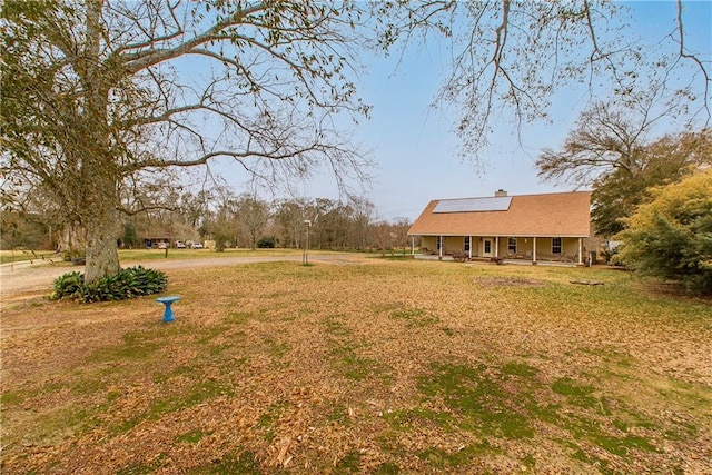 view of yard featuring a porch