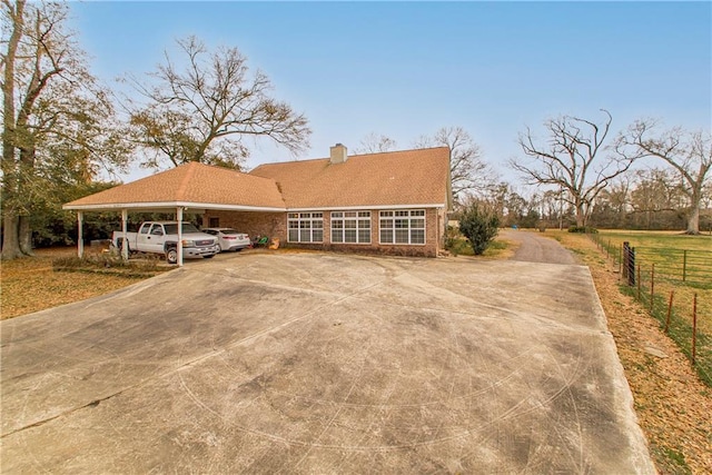 view of front of home featuring a carport