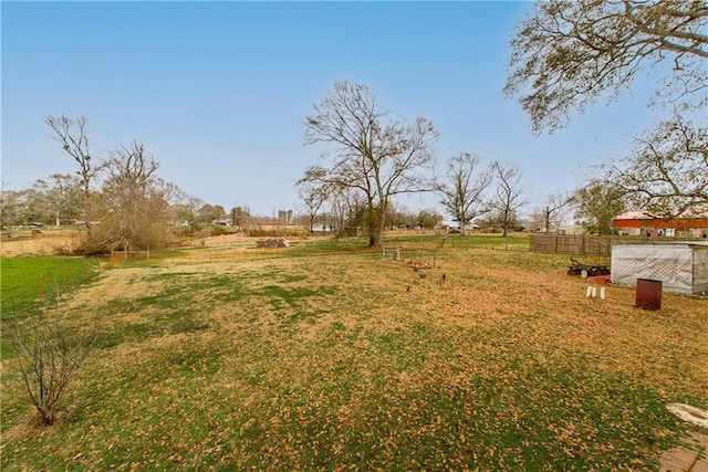 view of yard with a rural view