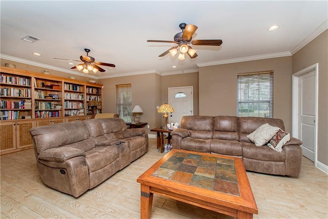 living room with crown molding, light hardwood / wood-style floors, and ceiling fan