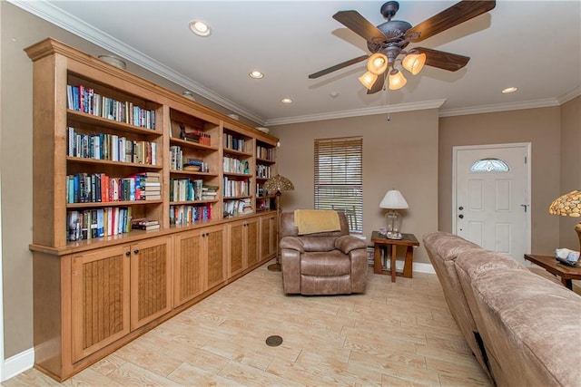 living area featuring ornamental molding, ceiling fan, and light hardwood / wood-style flooring