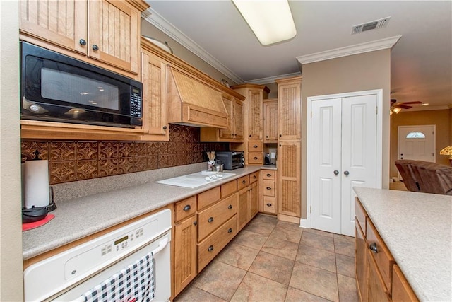 kitchen featuring light tile patterned floors, crown molding, ceiling fan, white stovetop, and tasteful backsplash