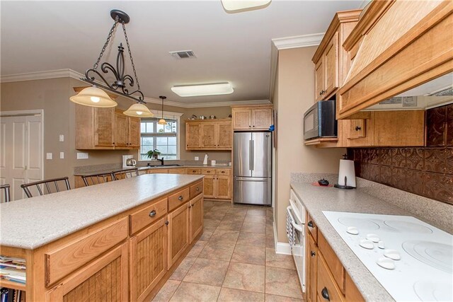 kitchen with premium range hood, white appliances, ornamental molding, and hanging light fixtures