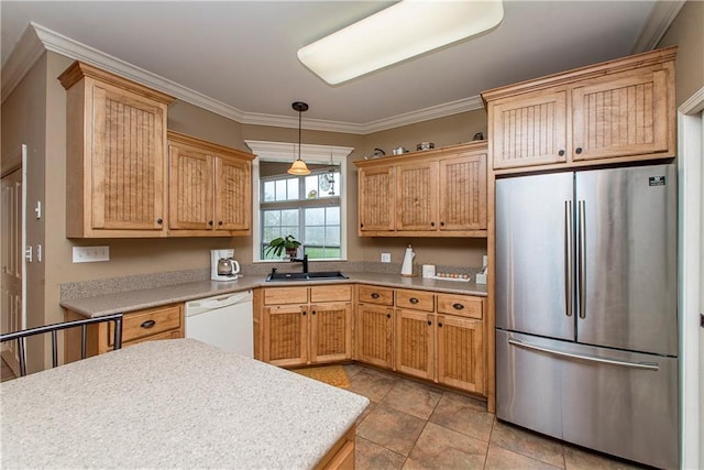 kitchen with stainless steel refrigerator, decorative light fixtures, sink, white dishwasher, and crown molding