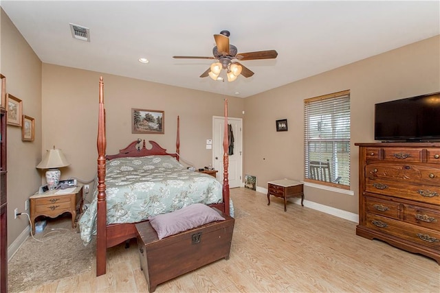 bedroom with ceiling fan and light wood-type flooring