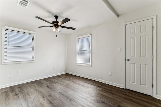 empty room featuring dark hardwood / wood-style floors and ceiling fan