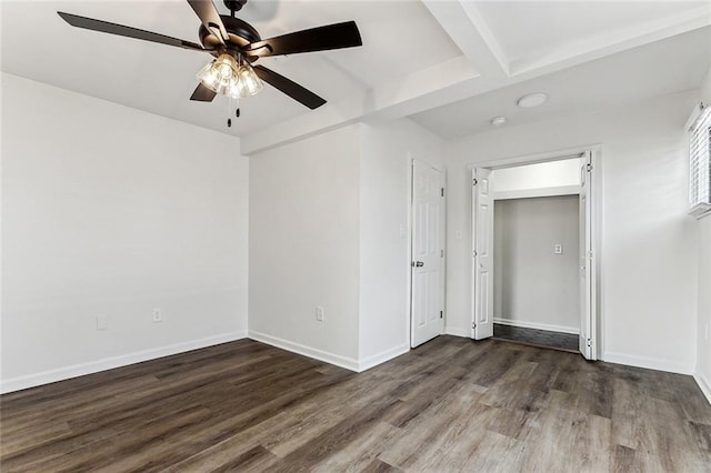 unfurnished room featuring dark hardwood / wood-style floors and ceiling fan