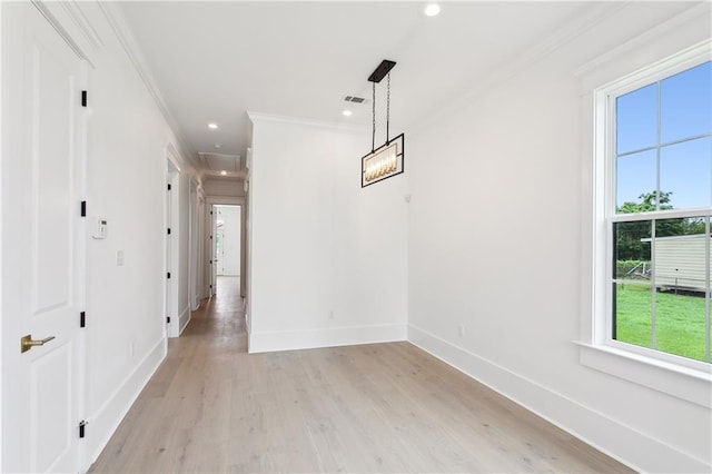 interior space with ornamental molding and light wood-type flooring