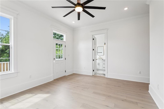 spare room with ceiling fan, ornamental molding, sink, and light hardwood / wood-style flooring