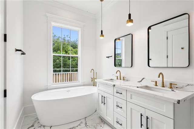 bathroom with ornamental molding, a bathtub, and vanity