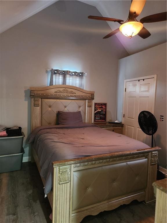 bedroom featuring lofted ceiling, dark wood-type flooring, and ceiling fan