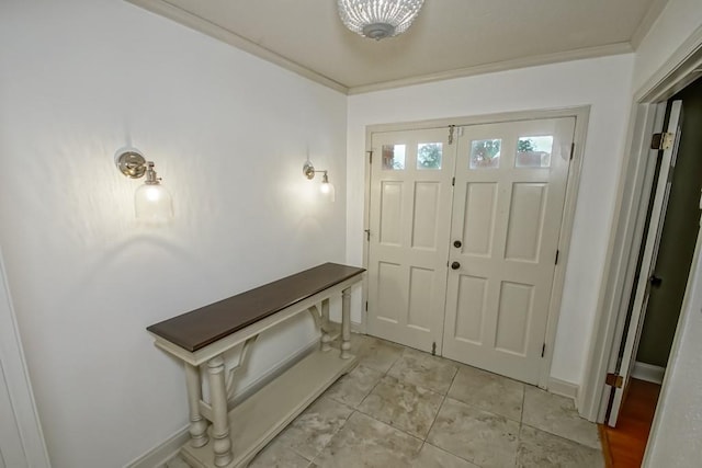 foyer entrance with light tile patterned flooring and ornamental molding