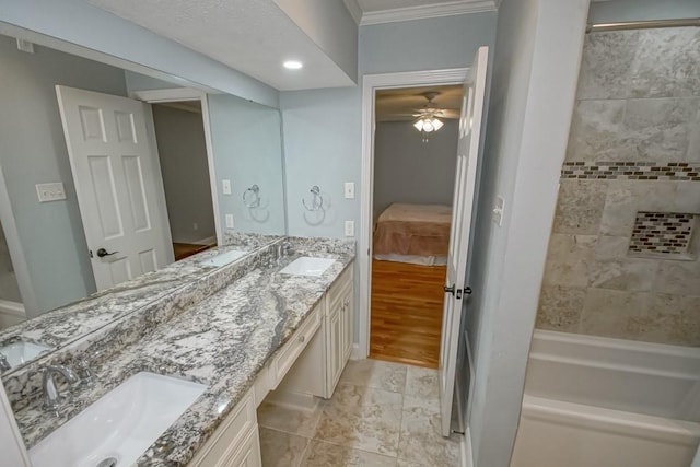 bathroom with vanity, ornamental molding, and ceiling fan