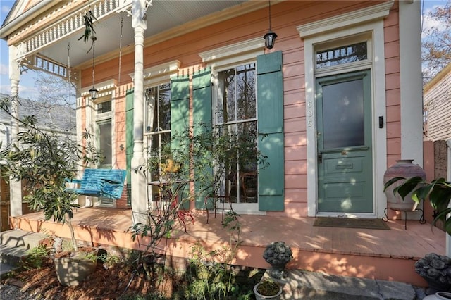 doorway to property featuring a porch