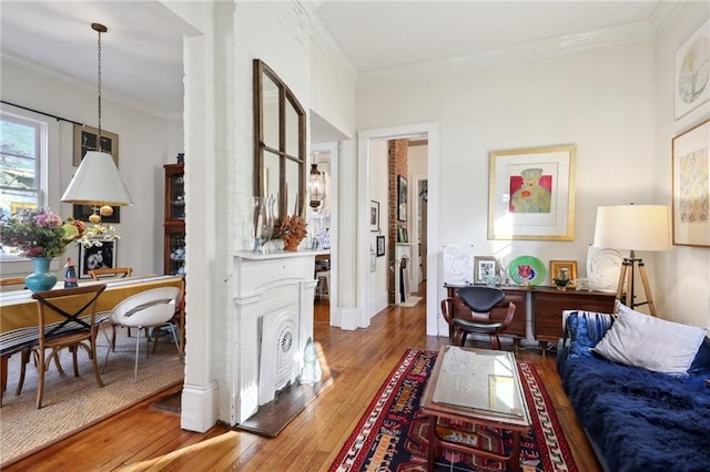 sitting room featuring crown molding and wood-type flooring