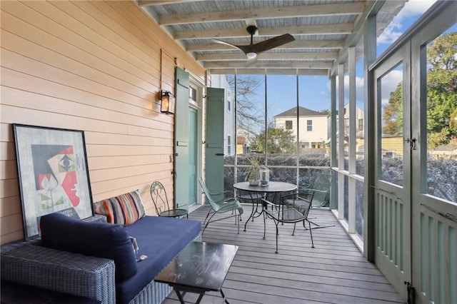 sunroom with beamed ceiling