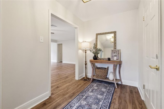 corridor featuring dark hardwood / wood-style floors