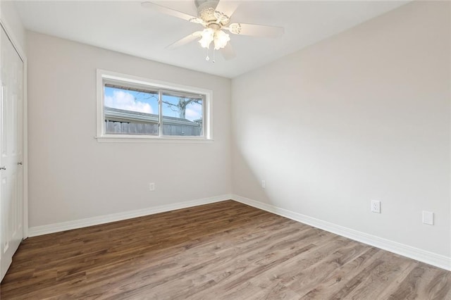 unfurnished room with hardwood / wood-style flooring and ceiling fan