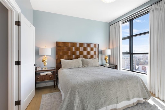 bedroom with light wood-type flooring