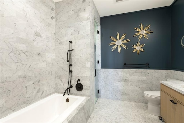 full bathroom featuring vanity, separate shower and tub, tile walls, and toilet