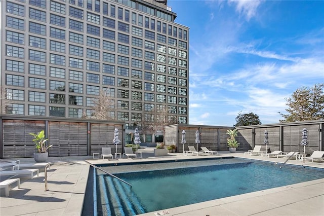 view of swimming pool featuring a patio area