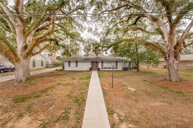 ranch-style house with a front lawn