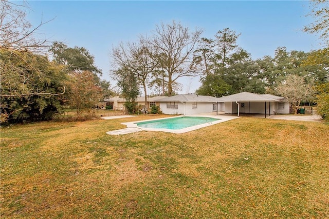 view of pool with a yard and a patio