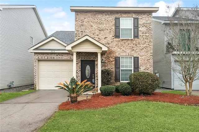 view of front of house with a garage and a front lawn