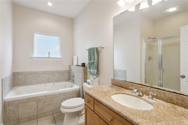 full bathroom featuring tile patterned flooring, vanity, shower with separate bathtub, and toilet