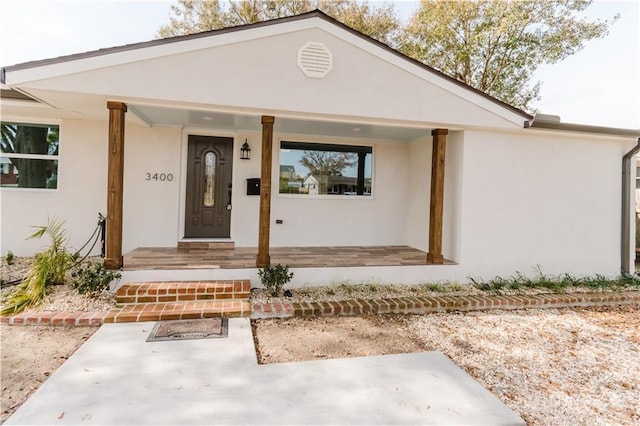 property entrance featuring covered porch