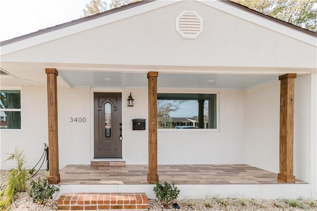 entrance to property with a porch