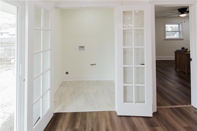 clothes washing area featuring hardwood / wood-style flooring and ceiling fan