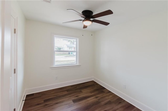 spare room featuring ceiling fan and dark hardwood / wood-style flooring