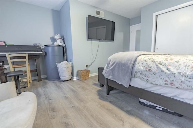 bedroom with light hardwood / wood-style flooring