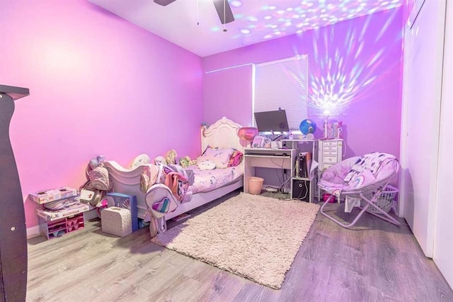 bedroom featuring ceiling fan and light wood-type flooring