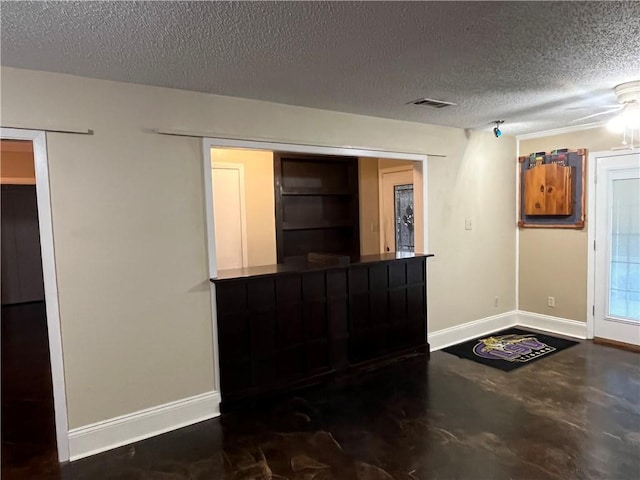 foyer featuring a textured ceiling