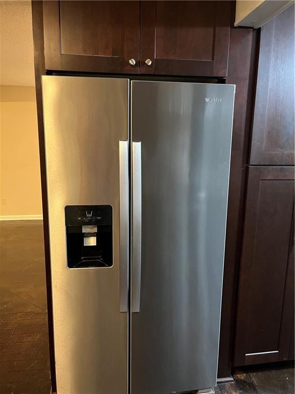 details with stainless steel fridge with ice dispenser and dark brown cabinets