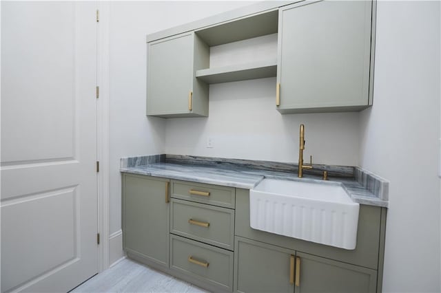 kitchen featuring gray cabinetry and sink