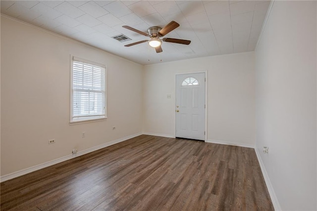 unfurnished room with wood-type flooring, ornamental molding, and ceiling fan