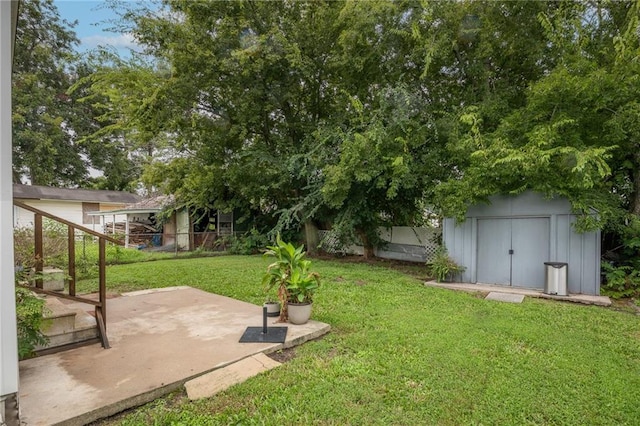 view of yard with a patio and a shed