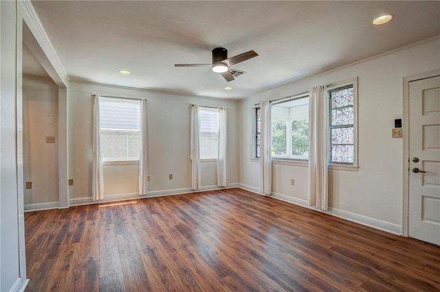 interior space with dark hardwood / wood-style flooring, ornamental molding, and ceiling fan