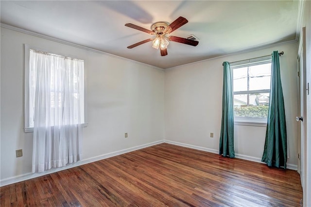 empty room with ornamental molding, dark hardwood / wood-style floors, and ceiling fan