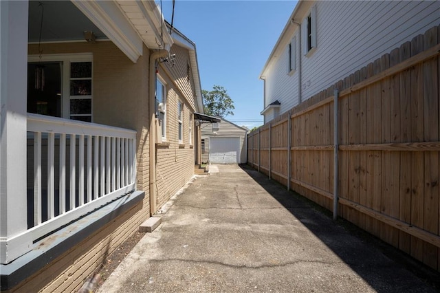 view of side of property featuring a garage and an outdoor structure