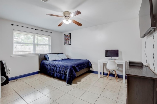 tiled bedroom with ceiling fan