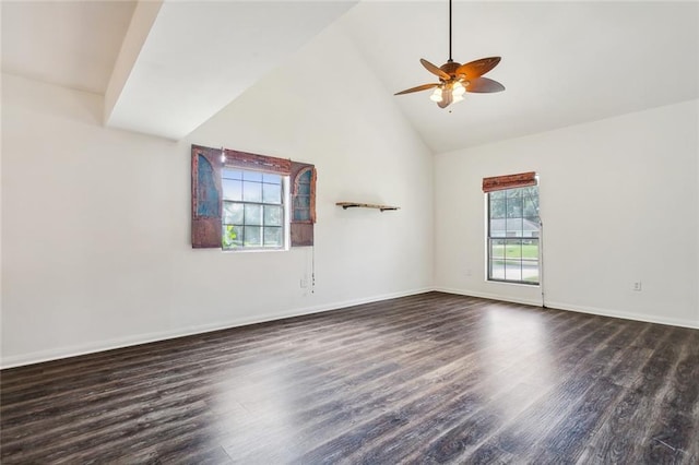 spare room with baseboards, high vaulted ceiling, dark wood finished floors, and a ceiling fan