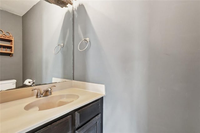 half bath with vanity and toilet