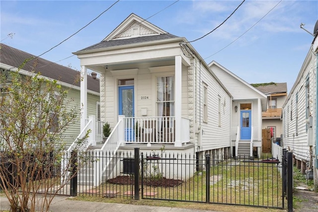 bungalow-style home featuring a front yard