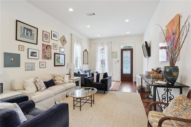 living room with dark hardwood / wood-style floors