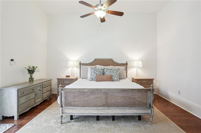 bedroom featuring dark hardwood / wood-style floors and ceiling fan