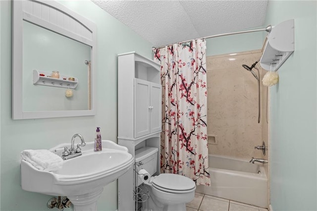 full bathroom with toilet, sink, a textured ceiling, shower / bath combo, and tile patterned flooring